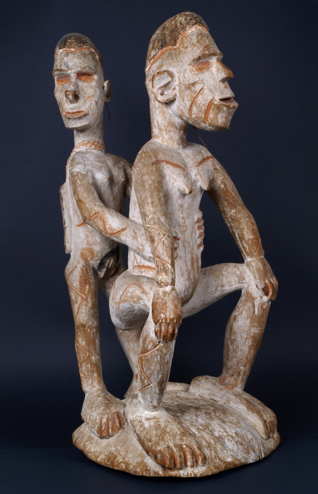 Woman in labor and midwife in the Asmat culture